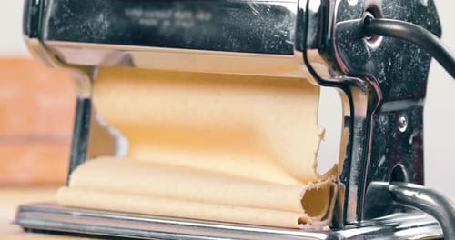 Fresh Pasta Rolling Through Pasta Machine