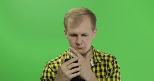 Adult Man Using Smartphone on Chroma Key Green Screen