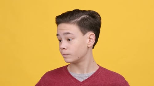 Teen Boy Shaking Head Saying No Expressing Disagreement Yellow Background
