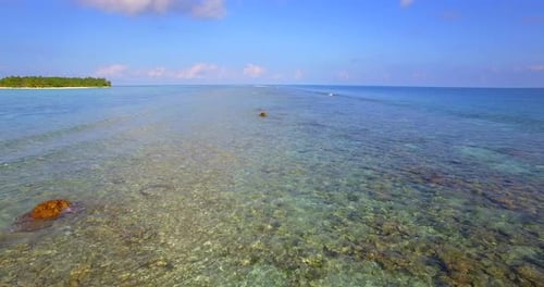 Aerial drone view of a scenic tropical island in the Maldives