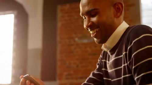 Happy man using mobile phone 4k