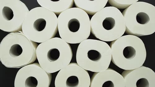 Rolls of Toilet Paper Placed on Black Background