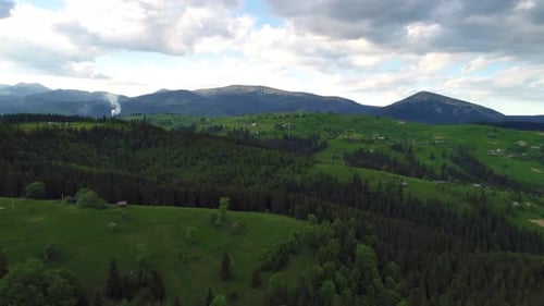 Mountain Village Under Cloudy Sky