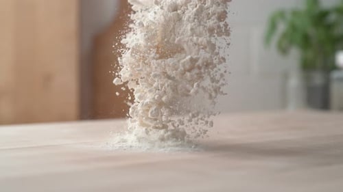 Powdery White Flour Falling on Wooden Surface