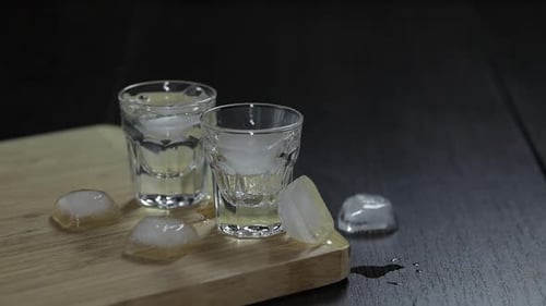 Liquor Being Poured Into Glasses with Ice