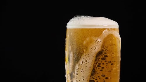 Close up of Beer Being Poured into Glass