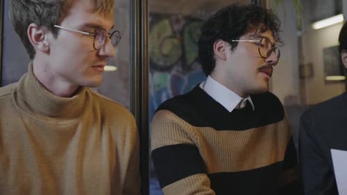 Businessmen Working with Documents in Cafe. Entrepreneurs Reading Documents