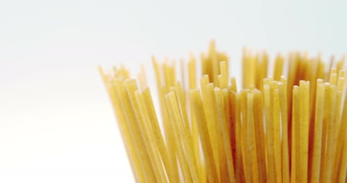 Close Up of Uncooked Spaghetti on White Background