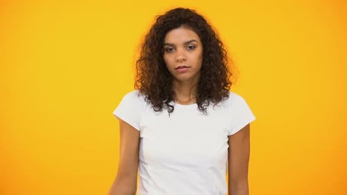 Discontent Biracial Lady Gesturing Facepalm on Camera Against Yellow Background