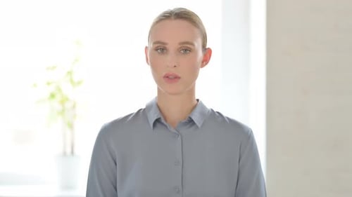 Portrait of Woman Shaking Head As No Sign