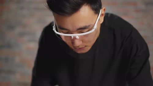 Young Adult Wearing Safety Glasses Close Up