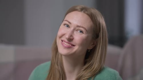Smiling Woman Close Up Portrait in an Indoor Setting