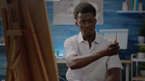 Artist Working on Drawing at Home Indoors