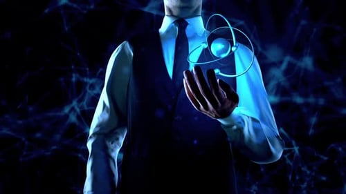 Businessman Holds Atom Particle In Left Hand With Plexus Network Connection Lines