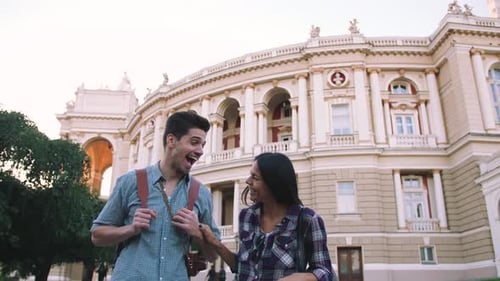 Young Mixed Race Tourist Couple Walking Through the City and Having Some Fun Slow Motion