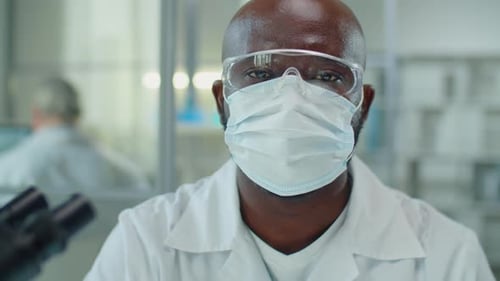 Scientist in Mask and Safety Glasses
