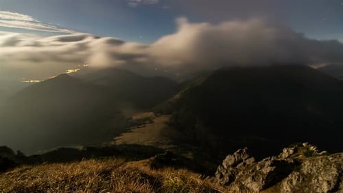 Mountain Range at Night with City Lights