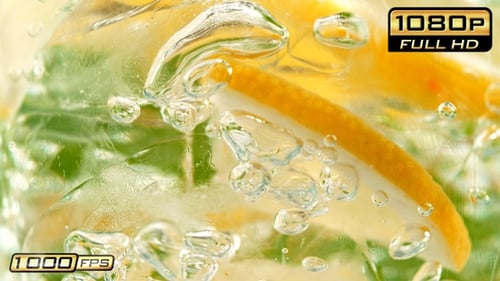 Refreshing lemon mint sparkling drink with ice cubes