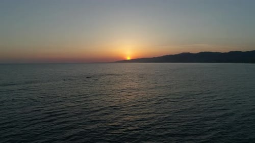 Aerial view of the ocean at sunset
