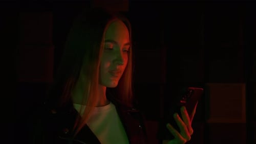 Young Adult Using Smartphone at Night