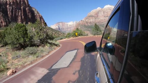 Driving Scenic Route Through Arid Desert Landscape