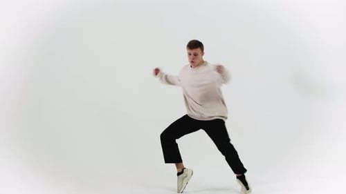 Young Stylish Man Dancing on Cyclorama