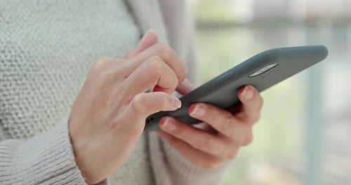 Hands Typing on Smartphone Close Up