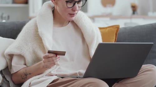 Young Woman Shopping Online with Laptop