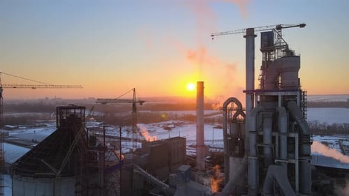 Aerial View of Cement Factory Tower with High Concrete Plant Structure at Industrial Production Area
