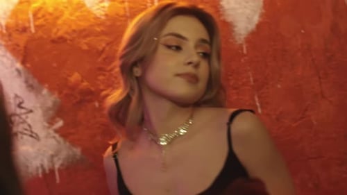 Blonde Young Woman Posing in Front of Graffiti Wall