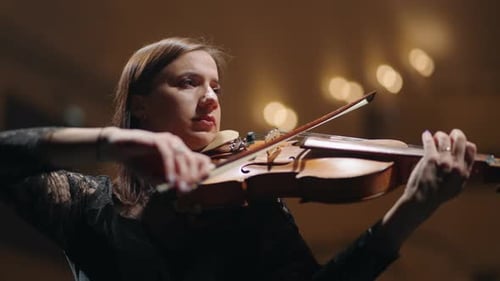 Woman is Playing Viola in Music Hall Portrait of Female Musician on Scene of Music Hall