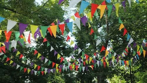 Festive Garland of Multi-colored Paper Flags for the Holiday. Scenery for a Children's Birthday