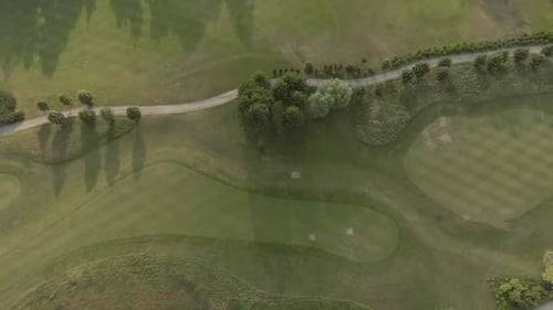 Aerial View of Large Luxury Golf Course. View of the Green Lawns and Trees. Shooting From Above, Top