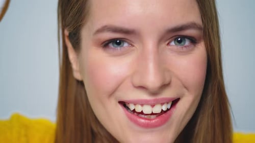Woman Plays with Donuts Close Up in Studio