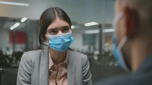 Woman Wearing Mask in Professional Workplace Environment