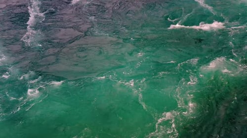 Waves of Water of the River and the Sea Meet Each Other