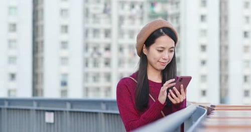 Woman Use of Mobile Phone in City