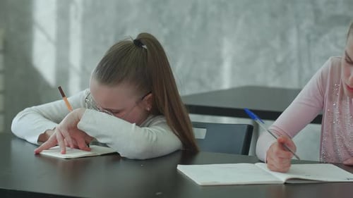 Schoolgirl Tired During Class
