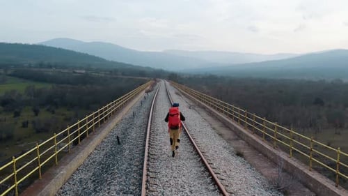 Epic Cinematic Sunset Shot of Man Walk on Bridge