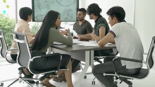Diverse Team Discussing Plans in an Office Setting