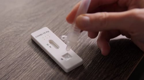 Applying Sample to Covid-19 Rapid Antigen Test