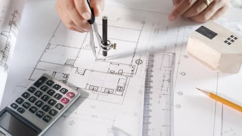 Engineer sketching construction project