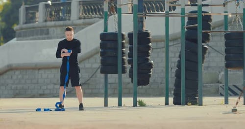 Athlete is Actively Jumping Rope on the Playground