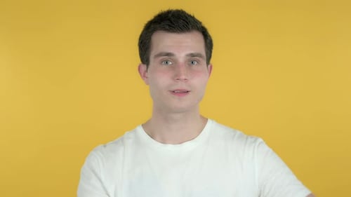 Young Adult Making Heart Shape with Hands