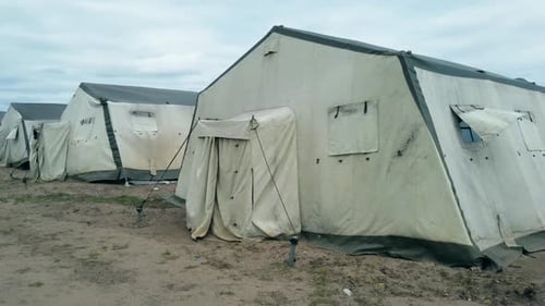 Old Soldiers Canvas Tents Torn in the Wind in the Field