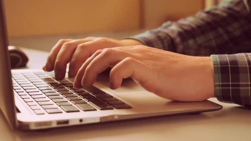 Closeup Guy Surfing Internet on PC