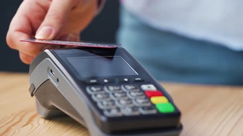 Credit Card Swiped Through Payment Reader