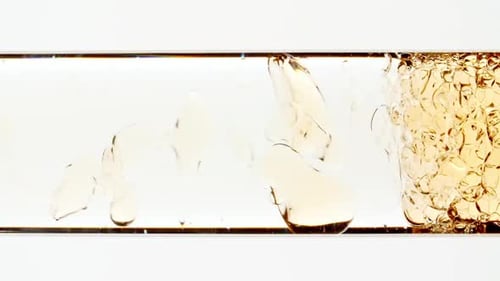 Macro Shot of Yellow Air Bubbles on White Background