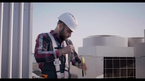 Engineer Rolling Up Cable