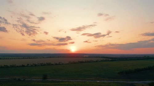 Aerial View. Beautiful Nature, View on Rural Countryside Landscape and Fields, Shining Sun Sunset